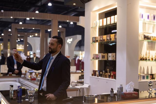 (251125) -- MANAMA, Nov. 25, 2025 (Xinhua) -- An exhibitor showcases perfumes at the "Scent Arabia" exhibition in Manama, Bahrain, Nov. 25, 2025. The "Scent Arabia" exhibition opened at Exhibition World Bahrain in Manama, Bahrain on Tuesday, featuring over 100 brands from the Gulf countries and worldwide, including perfumes, home fragrances and Arabian incense. The event is scheduled to run through Nov. 29. (Xinhua/Chen Junqing)