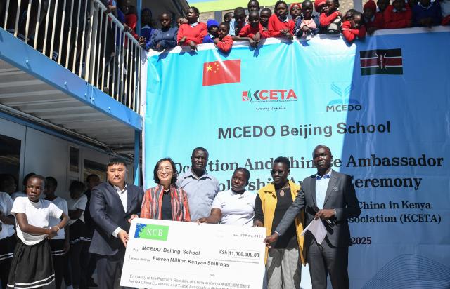 (251125) -- NAIROBI, Nov. 25, 2025 (Xinhua) -- This photo taken on Nov. 25, 2025 shows a donation ceremony held at MCEDO Beijing School in Nairobi, Kenya. TO GO WITH "Chinese embassy, enterprises donate funds to upgrade" (Xinhua/Li Yahui)