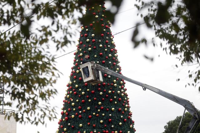 (251125) -- BETHLEHEM, Nov. 25, 2025 (Xinhua) -- Photo taken on Nov. 25, 2025, shows the installation of a Christmas tree in the Manger Square in the West Bank city of Bethlehem before the Christmas season. The decorations and lighting are expected to be completed in the coming days, ahead of announcing this year's Christmas program. (Photo by Mamoun Wazwaz/Xinhua)