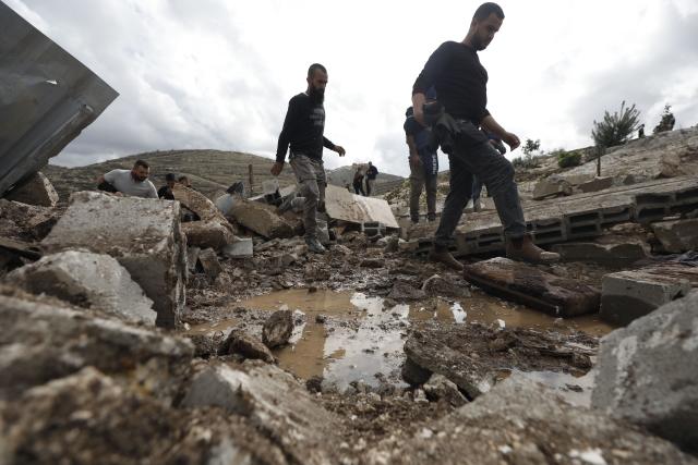 (251125) -- JENIN, Nov. 25, 2025 (Xinhua) -- Palestinians inspect the damage at the site where a Palestinian man was killed in the Marka area south of Jenin in the West Bank, Nov. 25, 2025. (Photo by Nidal Eshtayeh/Xinhua)