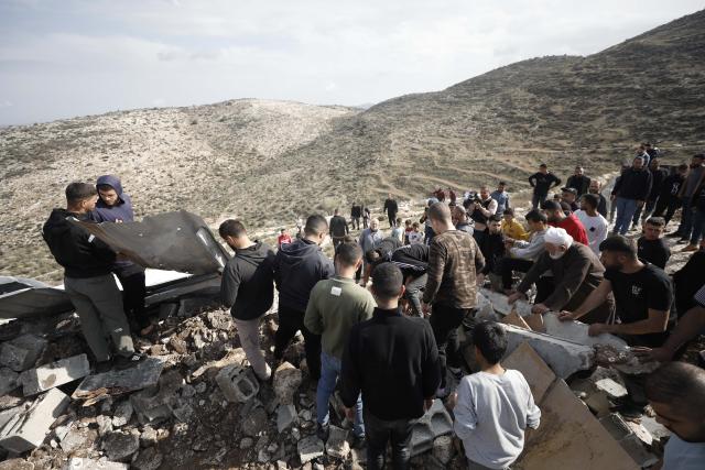(251125) -- JENIN, Nov. 25, 2025 (Xinhua) -- Palestinians inspect the damage at the site where a Palestinian man was killed in the Marka area south of Jenin in the West Bank, Nov. 25, 2025. (Photo by Nidal Eshtayeh/Xinhua)
