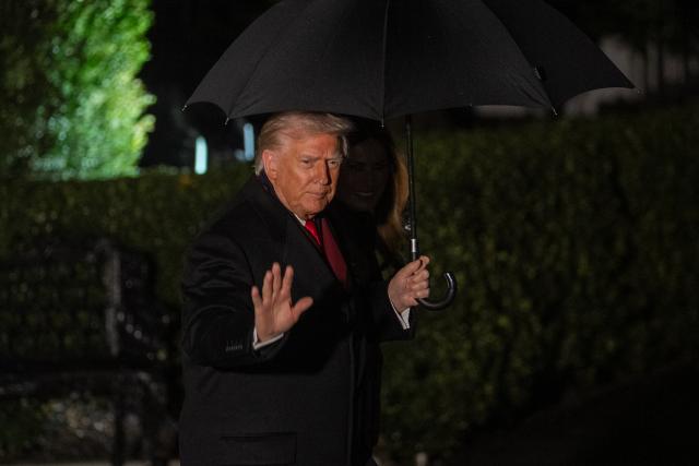 (251125) -- WASHINGTON, Nov. 25, 2025 (Xinhua) -- U.S. President Donald Trump and First Lady Melania Trump depart the White House in Washington, D.C. on Nov. 25, 2025. U.S. President Donald Trump said Tuesday he has directed his special envoy Steve Witkoff to meet with Russian President Vladimir Putin in Moscow in hope of finalizing a peace deal on the Ukraine crisis. (Xinhua/Hu Yousong)