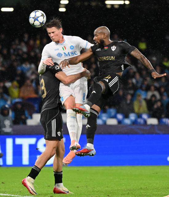 (251126) -- NAPLES, Nov. 26, 2025 (Xinhua) -- Napoli's Scott McTominay (C) vies with Qarabag's Bahlul Mustafazade (L) and Kevin Medina during the UEFA Champions League match between Napoli and Qarabag in Naples, Italy, Nov. 25, 2025. (Photo by Alberto Lingria/Xinhua)