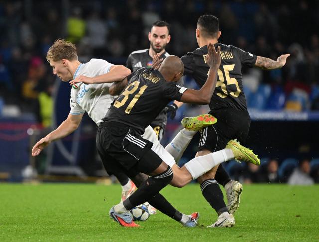 (251126) -- NAPLES, Nov. 26, 2025 (Xinhua) -- Napoli's Rasmus Hojlund (L) vies with Qarabag's Kevin Medina (C) and Pedro Bicalho during the UEFA Champions League match between Napoli and Qarabag in Naples, Italy, Nov. 25, 2025. (Photo by Alberto Lingria/Xinhua)