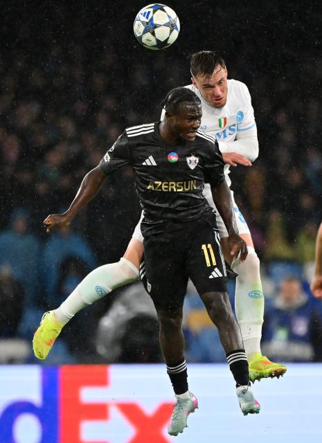 (251126) -- NAPLES, Nov. 26, 2025 (Xinhua) -- Napoli's Sam Beukema (R) vies with Qarabag's Emmanuel Addai during the UEFA Champions League match between Napoli and Qarabag in Naples, Italy, Nov. 25, 2025. (Photo by Alberto Lingria/Xinhua)