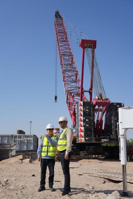 (251126) -- BAGHDAD, Nov. 26, 2025 (Xinhua) -- Gao Shoujiang (L), executive deputy manager of the Najaf 2×9E Add-On Combine-Cycle Power Plant Project, and Naseem Ayad, Najaf project manager on the Iraqi side, inspect the project site in Najaf Province, Iraq, Nov. 20, 2025.
  TO GO WITH "Roundup: Chinese standards, equipment help ease Iraq's long-standing power shortage" (Xinhua/Duan Minfu)