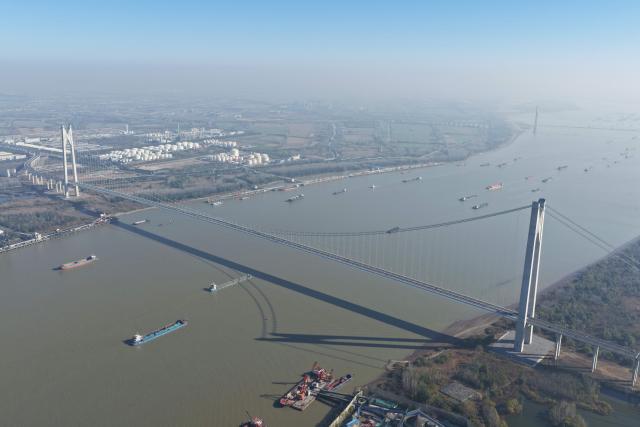 (251126) -- NANJING, Nov. 26, 2025 (Xinhua) -- An aerial drone photo taken on Nov. 26, 2025 shows the Nanjing Xinshengwei Yangtze River Bridge in Nanjing, east China's Jiangsu Province. The bridge opened to public traffic on Wednesday. Spanning approximately 13.17 kilometers, the bridge has a main line with three lanes in each direction and a design speed of 80 km per hour. (Xinhua/Mao Jun)