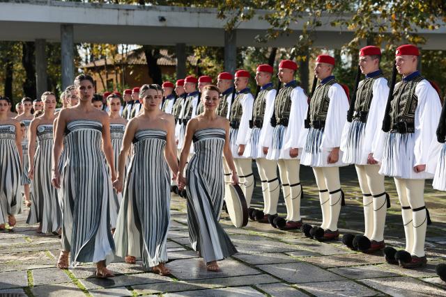 (251126) -- ANCIENT OLYMPIA, Nov. 26, 2025 (Xinhua) -- Presidential guards and performers in the role of priestesses are seen before the Olympic flame lighting ceremony for the Milan-Cortina 2026 Winter Olympic Games in Ancient Olympia, Greece, on Nov. 26, 2025. (Xinhua/Li Jing)
