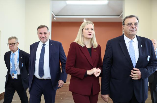 (251126) -- ANCIENT OLYMPIA, Nov. 26, 2025 (Xinhua) -- International Olympic Committee (IOC) President Kirsty Coventry (2nd R) and Isidoros Kouvelos, president of the Hellenic Olympic Committee arrive at the Archaeological Museum of Olympia before the Olympic flame lighting ceremony for the Milan-Cortina 2026 Winter Olympic Games in Ancient Olympia, Greece, on Nov. 26, 2025. (Xinhua/Li Jing)