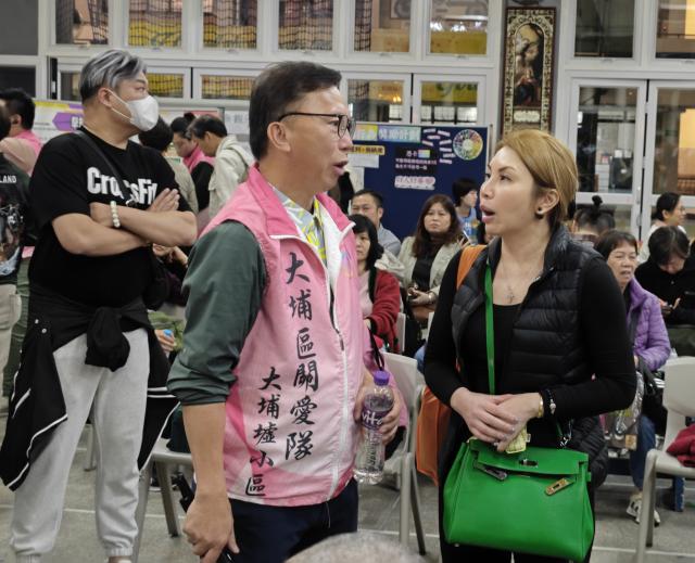 (251126) -- HONG KONG, Nov. 26, 2025 (Xinhua) -- A care team member works at an inter-departmental help desk after a fire broke out at a residential building in the Tai Po area in Hong Kong, south China, Nov. 26, 2025. Thirteen people were killed after a huge fire engulfed a residential area in the Tai Po area of Hong Kong on Wednesday afternoon, according to a press release issued by the Hong Kong Special Administrative Region (HKSAR) government. (Xinhua/Chen Duo)