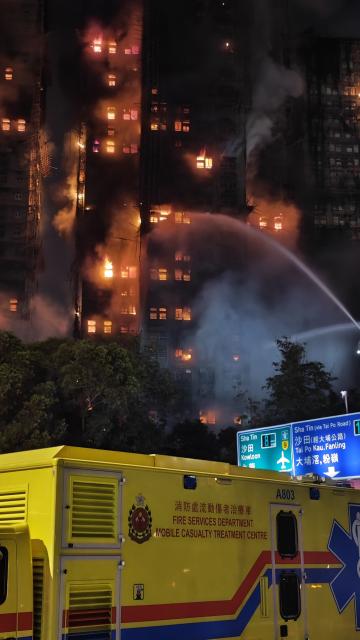 (251126) -- HONG KONG, Nov. 26, 2025 (Xinhua) -- This photo taken on Nov. 26, 2025 shows rescuers working on a residential building fire site in Hong Kong, south China. Thirteen people were killed after a huge fire engulfed a residential area in the Tai Po area of Hong Kong on Wednesday afternoon, according to a press release issued by the Hong Kong Special Administrative Region (HKSAR) government. (Xinhua/Chen Duo)