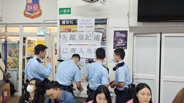 (251126) -- HONG KONG, Nov. 26, 2025 (Xinhua) -- Police officers work at an inter-departmental help desk after a fire broke out at a residential building in the Tai Po area in Hong Kong, south China, Nov. 26, 2025. Thirteen people were killed after a huge fire engulfed a residential area in the Tai Po area of Hong Kong on Wednesday afternoon, according to a press release issued by the Hong Kong Special Administrative Region (HKSAR) government. (Xinhua/Chen Duo)