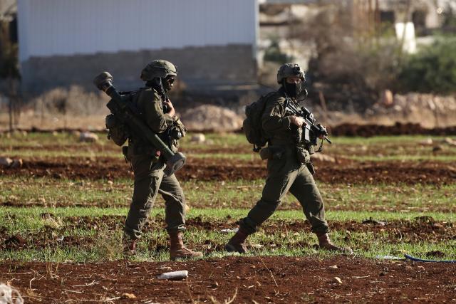 (251126) -- TUBAS, Nov. 26, 2025 (Xinhua) -- Israeli soldiers patrol during a large-scale military operation in the West Bank city of Tubas, Nov. 26, 2025. Israel launched a large-scale military operation in the northern West Bank on Wednesday, imposing a curfew, setting up roadblocks, and deploying military forces, according to Israeli and Palestinian sources. (Photo by Nidal Eshtayeh/Xinhua)