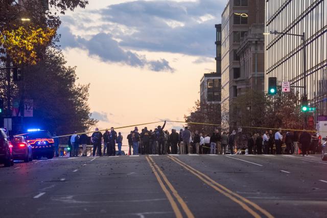 (251126) -- WASHINGTON, Nov. 26, 2025 (Xinhua) -- Law enforcement officials visit the crime scene following two National Guard members were shot near the White House in Washington, D.C., the United States, on Nov. 26, 2025. Two U.S. National Guard members were shot near the White House on Wednesday and a suspect is in custody, according to local authorities. (Xinhua/Hu Yousong)