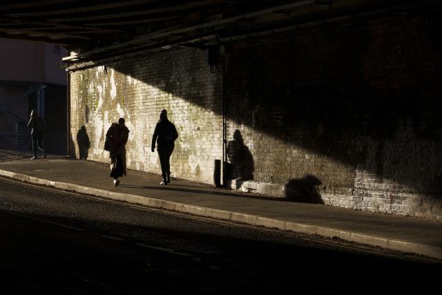 (251127) -- MANCHESTER, Nov. 27, 2025 (Xinhua) -- People walk under a bridge in Manchester, Britain, Nov. 26, 2025. British Chancellor of the Exchequer Rachel Reeves unveiled the 2025 Budget on Wednesday, pledging that the government will neither return the country to austerity nor allow public spending and borrowing to spiral, while vowing to ease pressures on the cost of living.
  According to a statement published on the British government's website, Reeves set out a wide range of proposals on public spending and taxation aimed at reducing borrowing and debt, safeguarding essential public services, stimulating economic growth, improving tax fairness, and advancing welfare reforms. (Photo by Jon Super/Xinhua)
