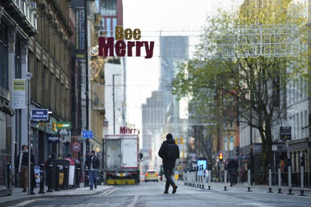 (251127) -- MANCHESTER, Nov. 27, 2025 (Xinhua) -- A man walks across a street in Manchester, Britain, Nov. 26, 2025. British Chancellor of the Exchequer Rachel Reeves unveiled the 2025 Budget on Wednesday, pledging that the government will neither return the country to austerity nor allow public spending and borrowing to spiral, while vowing to ease pressures on the cost of living.
  According to a statement published on the British government's website, Reeves set out a wide range of proposals on public spending and taxation aimed at reducing borrowing and debt, safeguarding essential public services, stimulating economic growth, improving tax fairness, and advancing welfare reforms. (Photo by Jon Super/Xinhua)