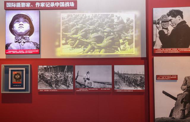 (251127) -- BEIJING, Nov. 27, 2025 (Xinhua) -- This photo taken on Nov. 14, 2025 shows photographic works by Hungarian-American photographer Robert Capa displayed at the exhibition titled "For a Common Cause: From the Spanish Battlefield to China's War of Resistance Against Japanese Aggression" at the Museum of the Communist Party of China (CPC) in Beijing, capital of China. (Xinhua/Yin Gang)
