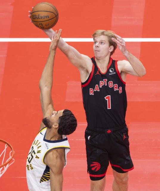 (251127) -- TORONTO, Nov. 27, 2025 (Xinhua) -- Gradey Dick (R) of Toronto Raptors fights for a rebound with Jeremiah Robinson-Earl of Indiana Pacers during the 2025-2026 NBA Cup group match between Toronto Raptors and Indiana Pacers in Toronto, Canada, on Nov. 26, 2025. (Photo by Zou Zheng/Xinhua)
