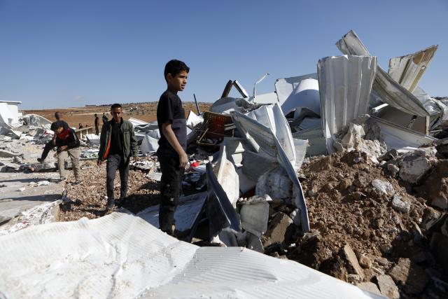 (251127) -- HEBRON, Nov. 27, 2025 (Xinhua) -- People check the rubble of commercial shops demolished by Israeli military bulldozers in south of the West Bank city of Hebron, Nov. 26, 2025. (Photo by Mamoun Wazwaz/Xinhua)