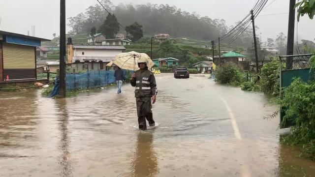 (251127) -- COLOMBO, Nov. 27, 2025 (Xinhua) -- This photo taken with a mobile phone shows a police officer wading through floodwater in Nuwara Eliya District, Sri Lanka's Central Province, Nov. 27, 2025. Sri Lanka is confronting one of its most severe weather disasters in recent years, as days of heavy rainfall and multiple landslides have killed 31 people, left 14 missing, and displaced thousands across the island, the Disaster Management Center (DMC) said on Thursday.
  According to the latest situation report, extreme weather has affected 17 districts, impacting 1,158 families and 4,008 individuals. The DMC said 10 people have been injured, three homes have been completely destroyed, and 381 houses partially damaged. At least 131 people have been relocated to temporary safe centers. (Photo by Gayan Sameera/Xinhua)
