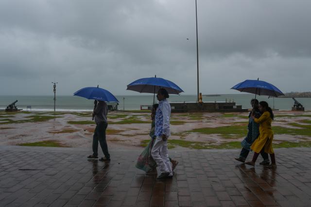 (251127) -- COLOMBO, Nov. 27, 2025 (Xinhua) -- People holding umbrellas walk in the rain on a street in Colombo, Sri Lanka, Nov. 27, 2025. Sri Lanka is confronting one of its most severe weather disasters in recent years, as days of heavy rainfall and multiple landslides have killed 31 people, left 14 missing, and displaced thousands across the island, the Disaster Management Center (DMC) said on Thursday.
  Sri Lanka's Department of Meteorology on Thursday issued a red alert for both land and surrounding sea areas as the deep depression that had formed near the Sri Lankan coast in the Bay of Bengal has intensified into a cyclone, now named "Ditwah."
  Officials warned that heavy rains, strong winds, and hazardous sea conditions are expected to persist across the island over the coming days as the system advances. (Photo by Thilina Kaluthotage/Xinhua)