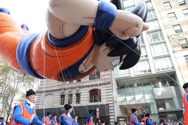 (251127) -- NEW YORK, Nov. 27, 2025 (Xinhua) -- The balloon of Goku is seen during the 2025 Macy's Thanksgiving Day Parade in New York, the United States, on Nov. 27, 2025. The traditional Macy's Thanksgiving Day Parade brought holiday cheer to New York City on Thursday morning, as giant character balloons floated above Manhattan in one of the United States' most watched holiday events. (Xinhua/Zhang Fengguo)