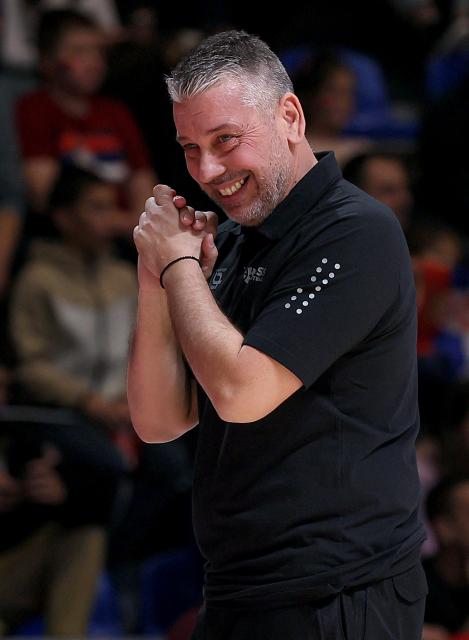 (251128) -- BELGRADE, Nov. 28, 2025 (Xinhua) -- Switzerland's head coach Ilias Papatheodorou reacts during the FIBA basketball World Cup 2027 European qualifiers first round group C match between Serbia and Switzerland in Belgrade, Serbia, Nov. 27, 2025. (Photo by Predrag Milosavljevic/Xinhua)