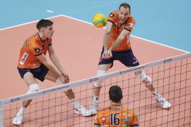 (251128) -- LJUBLJANA, Nov. 28, 2025 (Xinhua) -- Tine Urnaut (R) of ACH Volley Ljubljana digs the ball during the CEV Champions League Volley 2026 Men's 3rd round volleyball match between ACH Volley Ljubljana and Radnicki Kragujevac in Ljubljana, Slovenia, Nov. 27, 2025. (Photo by Zeljko Stevanic/Xinhua)