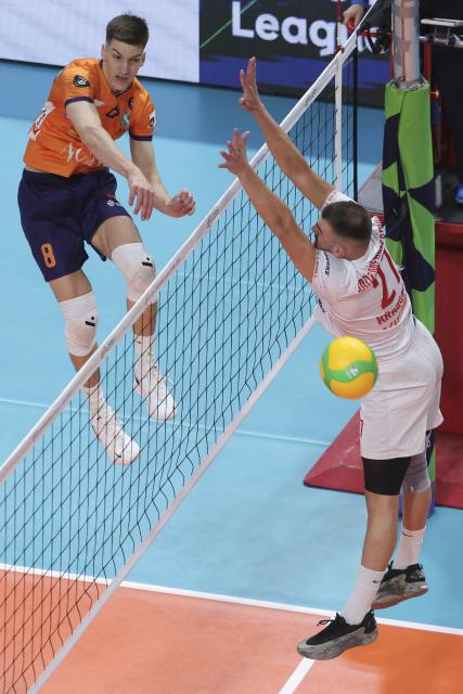(251128) -- LJUBLJANA, Nov. 28, 2025 (Xinhua) -- Luka Marovt (L) of ACH Volley Ljubljana spikes the ball during the CEV Champions League Volley 2026 Men's 3rd round volleyball match between ACH Volley Ljubljana and Radnicki Kragujevac in Ljubljana, Slovenia, Nov. 27, 2025. (Photo by Zeljko Stevanic/Xinhua)