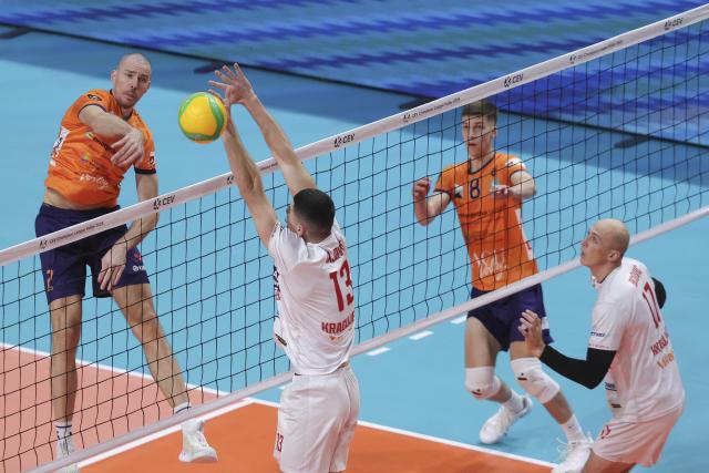 (251128) -- LJUBLJANA, Nov. 28, 2025 (Xinhua) -- Alen Pajenk (1st L) of ACH Volley Ljubljana spikes the ball during the CEV Champions League Volley 2026 Men's 3rd round volleyball match between ACH Volley Ljubljana and Radnicki Kragujevac in Ljubljana, Slovenia, Nov. 27, 2025. (Photo by Zeljko Stevanic/Xinhua)
