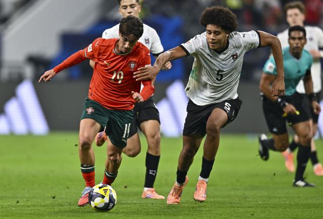 (251128) -- DOHA, Nov. 28, 2025 (Xinhua) -- Tomas Soares (L) of Portugal vies with Ifeanyi Arthur Ndukwe of Austria during the final match between Portugal and Austria at the FIFA U17 World Cup Qatar 2025 in Doha, Qatar, Nov. 27, 2025. Portugal won 1-0. (Photo by Nikku/Xinhua)
