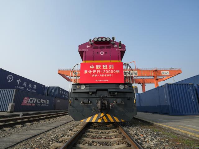 (251128) -- CHENGDU, Nov. 28, 2025 (Xinhua) -- The X8086 China-Europe freight train waits for departure at the Chengdu International Railway Port in Chengdu, southwest China's Sichuan Province, Nov. 28, 2025. As the X8086 train departed from Chengdu on Friday, the total number of China-Europe freight train trips has surpassed 120,000, with the total value of goods transported exceeding 490 billion U.S. dollars. (Xinhua/Wang Xi)