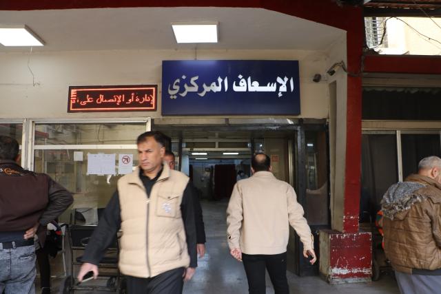 (251128) -- DAMASCUS, Nov. 28, 2025 (Xinhua) -- People are pictured outside the emergency unit of al-Mouwasat Hospital, where casualties from Israeli airstrikes on the nearby town of Beit Jinn have been admitted, in Damascus, Syria, Nov. 28, 2025. Israeli airstrikes early Friday killed at least 10 people, including women and children, in the town of Beit Jinn in the southwestern countryside of Damascus, following reported clashes between Israeli troops and local residents, Syrian state media said. (Photo by Monsef Memari/Xinhua)