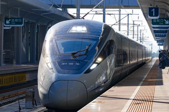 (251128) -- GUIYANG, Nov. 28, 2025 (Xinhua) -- G5356 train, the first train of the Panzhou-Xingyi high-speed railway, departs from Xingyi South Railway Station in Xingyi, southwest China's Guizhou Province, Nov. 28, 2025. With a design speed of 250 kilometers per hour, the 99-kilometer-long Panzhou-Xingyi high-speed railway officially opened to traffic on Friday, which will further enhance regional transportation networks and promote local economic development. (Photo by Long Jianrui/Xinhua)