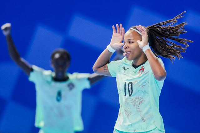 (251129) -- PASIG CITY, Nov. 29, 2025 (Xinhua) -- Maria Pereira (Front) of Portugal celebrates after scoring a point during the group C match between Portugal and New Zealand at the FIFA Futsal Women's World Cup 2025 in Pasig City, the Philippines on Nov. 29, 2025. (Xinhua/Rouelle Umali)