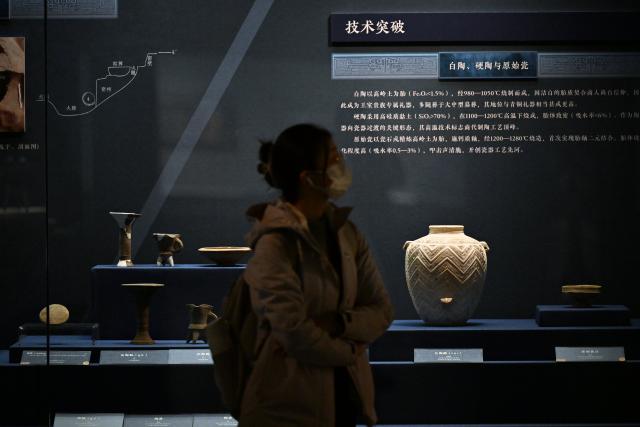 (251129) -- TIANJIN, Nov. 29, 2025 (Xinhua) -- A visitor views exhibits at an exhibition on cultural relics from the Shang Dynasty (1600 BC-1046 BC) at the Tianjin Museum in Tianjin, north China, Nov. 29, 2025. The exhibition, featuring more than 180 pieces (sets) of cultural relics from the Shang Dynasty, has received more than 400,000 visitors since its opening on Aug. 23. (Xinhua/Li Ran)