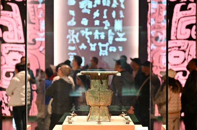 (251129) -- TIANJIN, Nov. 29, 2025 (Xinhua) -- People view an exhibition on cultural relics from the Shang Dynasty (1600 BC-1046 BC) at the Tianjin Museum in Tianjin, north China, Nov. 29, 2025. The exhibition, featuring more than 180 pieces (sets) of cultural relics from the Shang Dynasty, has received more than 400,000 visitors since its opening on Aug. 23. (Xinhua/Li Ran)