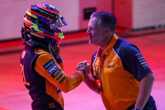 (251130) -- DOHA, Nov. 30, 2025 (Xinhua) -- McLaren's Australian Driver Oscar Piastri reacts with Team's CEO Zak Brown (R) after the Sprint race of the Formula One Qatar Grand Prix at the Lusail International Circuit in Doha, Qatar, on Nov. 29, 2025. (Photo by Li Chao/Xinhua)