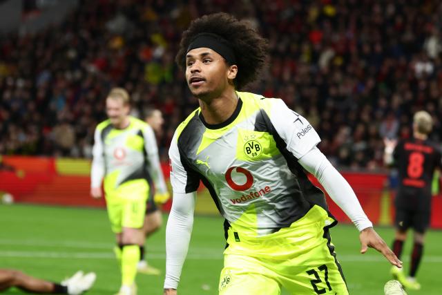 (251130) -- LEVERKUSEN, Nov. 30, 2025 (Xinhua) -- Karim Adeyemi of Borussia Dortmund celebrates scoring during the German first division of Bundesliga football match between Bayer 04 Leverkusen and Borussia Dortmund in Leverkusen, Germany, Nov. 29. 2025. (Photo by Joachim Bywaletz/Xinhua)
