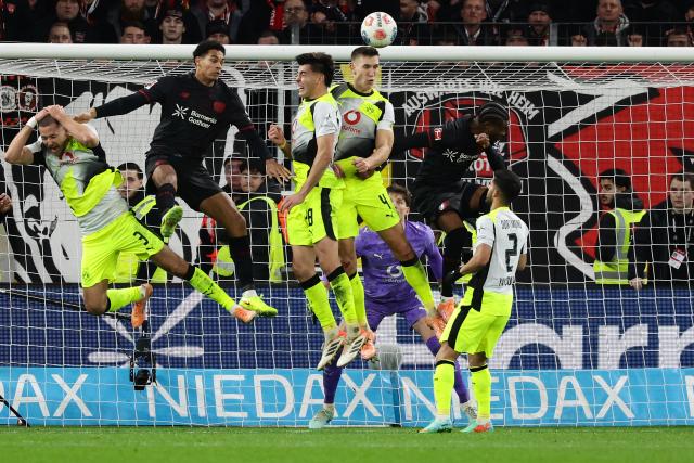 (251130) -- LEVERKUSEN, Nov. 30, 2025 (Xinhua) -- Players vie for the ball during the German first division of Bundesliga football match between Bayer 04 Leverkusen and Borussia Dortmund in Leverkusen, Germany, Nov. 29. 2025. (Photo by Joachim Bywaletz/Xinhua)