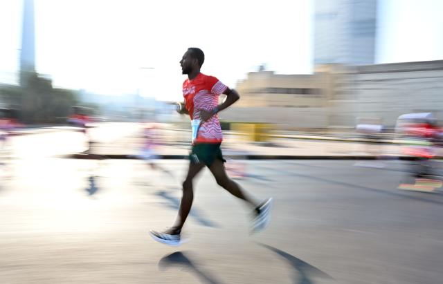 (251130) -- CAPITAL GOVERNORATE, Nov. 30, 2025 (Xinhua) -- A man participates in a marathon race in Capital Governorate, Kuwait, Nov. 29, 2025. (Photo by Asad/Xinhua)