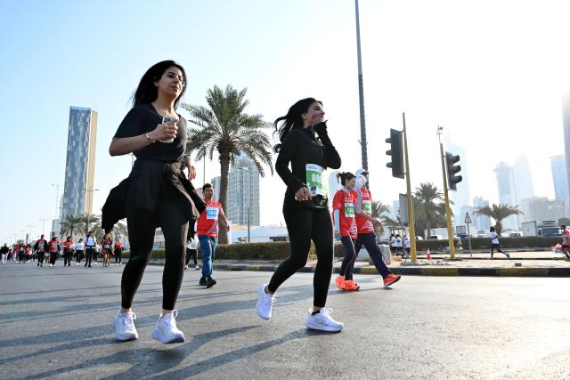 (251130) -- CAPITAL GOVERNORATE, Nov. 30, 2025 (Xinhua) -- People participate in a marathon race in Capital Governorate, Kuwait, Nov. 29, 2025. (Photo by Asad/Xinhua)