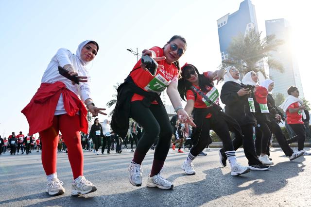 (251130) -- CAPITAL GOVERNORATE, Nov. 30, 2025 (Xinhua) -- People participate in a marathon race in Capital Governorate, Kuwait, Nov. 29, 2025. (Photo by Asad/Xinhua)
