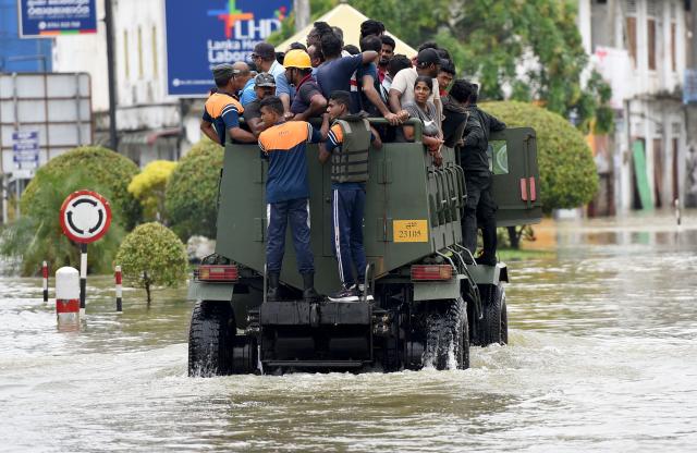 (251130) -- COLOMBO, Nov. 30, 2025 (Xinhua) -- Flood-affected people are transported to safe areas in Gampaha District, Sri Lanka, Nov. 29, 2025.
  Sri Lanka's Disaster Management Center (DMC) on Saturday evening said 153 people have died due to floods and landslides caused by Cyclone Ditwah. 
  The DMC said 774,724 people from 217,263 families across all districts have been affected by heavy rains, flooding, and landslides. It added that many areas remain inaccessible, complicating rescue efforts and relief distribution. (Photo by Gayan Sameera/Xinhua)