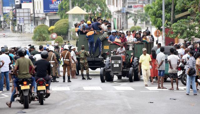 (251130) -- COLOMBO, Nov. 30, 2025 (Xinhua) -- Flood-affected people are transported to safe areas in Gampaha District, Sri Lanka, Nov. 29, 2025.
  Sri Lanka's Disaster Management Center (DMC) on Saturday evening said 153 people have died due to floods and landslides caused by Cyclone Ditwah. 
  The DMC said 774,724 people from 217,263 families across all districts have been affected by heavy rains, flooding, and landslides. It added that many areas remain inaccessible, complicating rescue efforts and relief distribution. (Photo by Gayan Sameera/Xinhua)