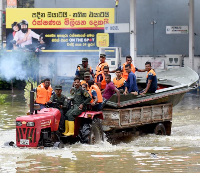 (251130) -- COLOMBO, Nov. 30, 2025 (Xinhua) -- Flood-affected people are transported to safe areas in Gampaha District, Sri Lanka, Nov. 29, 2025.
  Sri Lanka's Disaster Management Center (DMC) on Saturday evening said 153 people have died due to floods and landslides caused by Cyclone Ditwah. 
  The DMC said 774,724 people from 217,263 families across all districts have been affected by heavy rains, flooding, and landslides. It added that many areas remain inaccessible, complicating rescue efforts and relief distribution. (Photo by Gayan Sameera/Xinhua)