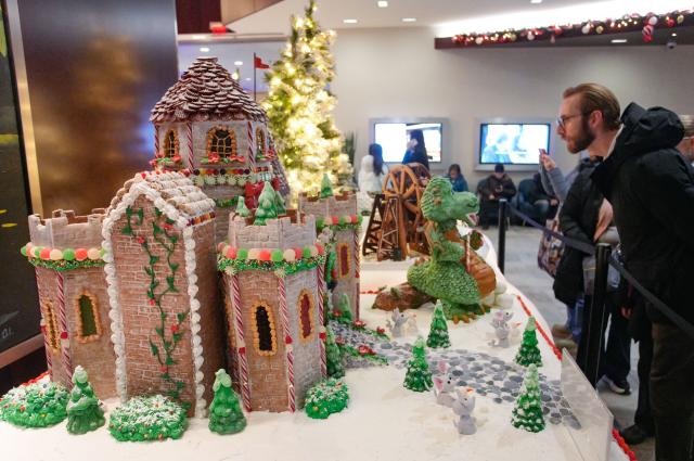(251130) -- VANCOUVER, Nov. 30, 2025 (Xinhua) -- A man looks at a gingerbread house creation during the annual "Gingerbread Lane" event in Vancouver, British Columbia, Canada, Nov. 29, 2025. Canada's longest-running gingerbread house display event returned for its 33rd year, featuring more than 30 gingerbread houses and inviting the public to vote for their favourite creations crafted by professional bakers, culinary artists, and culinary school students. (Photo by Liang Sen/Xinhua)