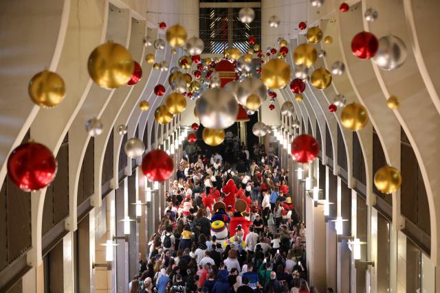 (251130) -- BEIRUT, Nov. 30, 2025 (Xinhua) -- People enjoy the Christmas atmosphere at the Beirut Souks in Beirut, Lebanon, Nov. 29, 2025. The Christmas season kicked off with the lighting of a Christmas tree and the unveiling of festive decorations at the Beirut Souks on Saturday night. (Xinhua/Bilal Jawich)