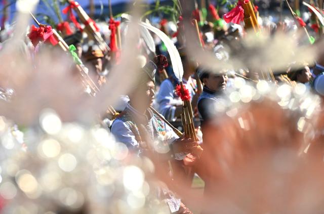(251130) -- NANNING, Nov. 30, 2025 (Xinhua) -- People perform with Lusheng, a traditional reed-pipe wind instrument, to celebrate Lusheng and horse fighting festival in Rongshui Miao Autonomous County, south China's Guangxi Zhuang Autonomous Region, Nov. 29, 2025. Rongshui County has leveraged its unique cultural resources of Lusheng to strengthen the inheritance of Miao ethnic culture and empower rural revitalization. (Xinhua/Huang Xiaobang)