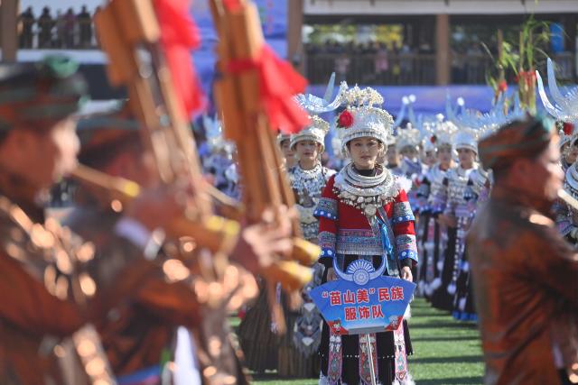 (251130) -- NANNING, Nov. 30, 2025 (Xinhua) -- People attend the opening ceremony of the Lusheng and horse fighting festival in Rongshui Miao Autonomous County, south China's Guangxi Zhuang Autonomous Region, Nov. 29, 2025. Rongshui County has leveraged its unique cultural resources of Lusheng to strengthen the inheritance of Miao ethnic culture and empower rural revitalization. (Xinhua/Huang Xiaobang)